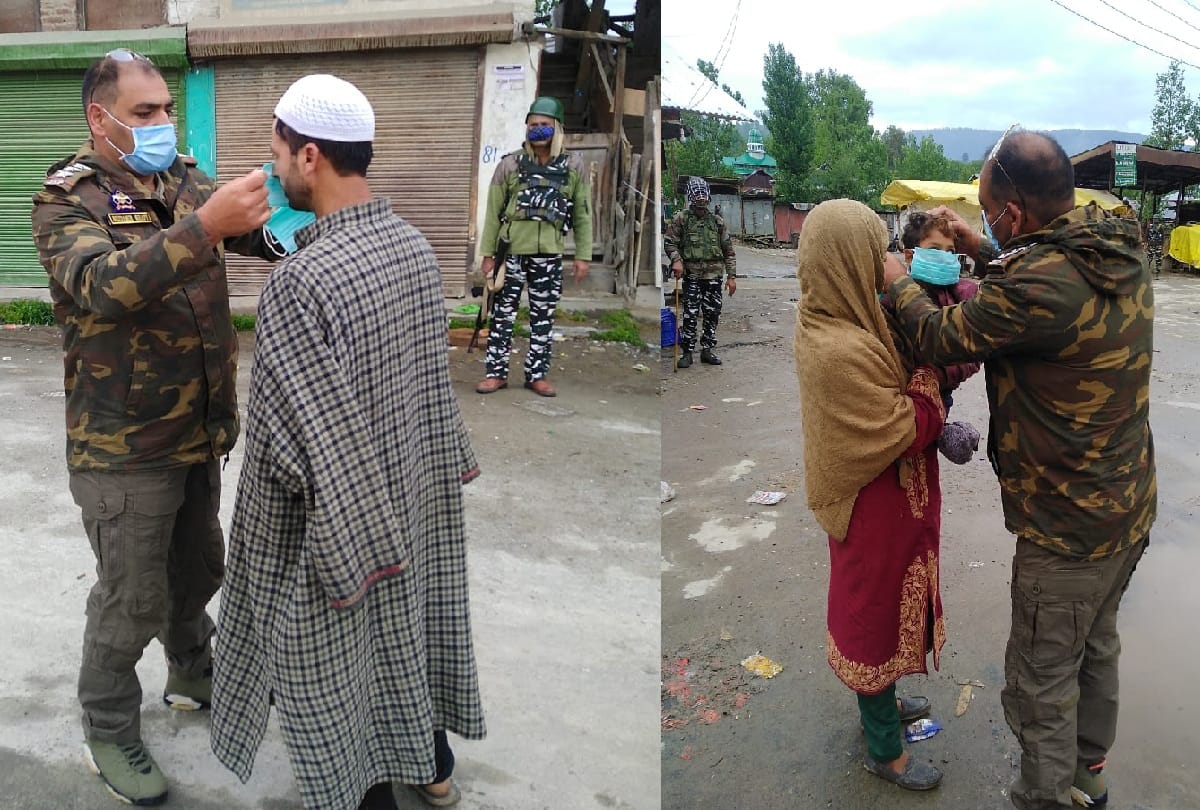 SHO Mudassir Ahmed is giving masks to people in Sopore Kashmir