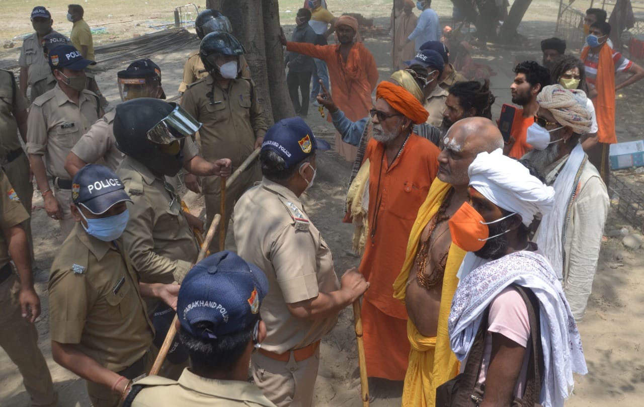 haridwar news: illegal construction collapse in bairagi camp, saint become angry, throw stone on officers, photos