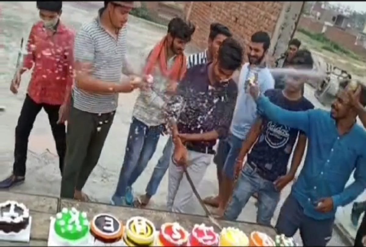 young man cut birthday party cake with the sword, firing from the illegal gun IN aligarh