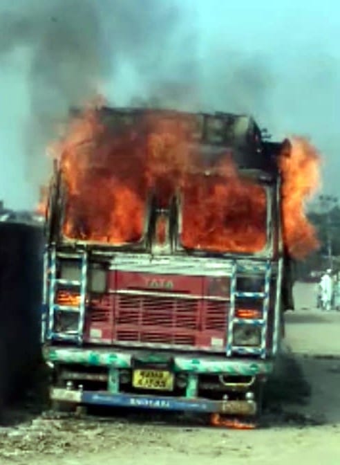 fire in a truck parked on the road