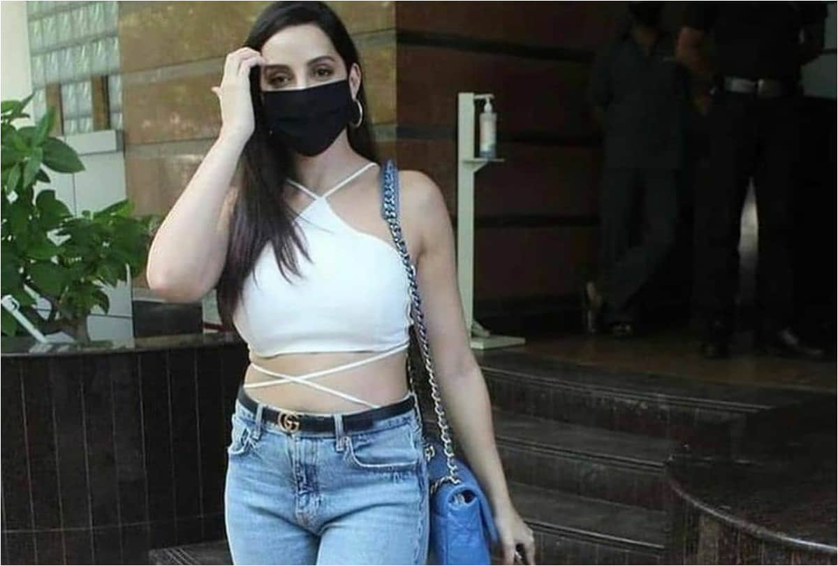 nora fatehi spotted in outside dubbing studio wearing white crop top show her curvy waist