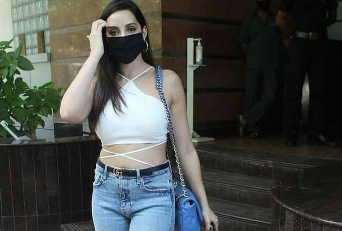 nora fatehi spotted in outside dubbing studio wearing white crop top show her curvy waist