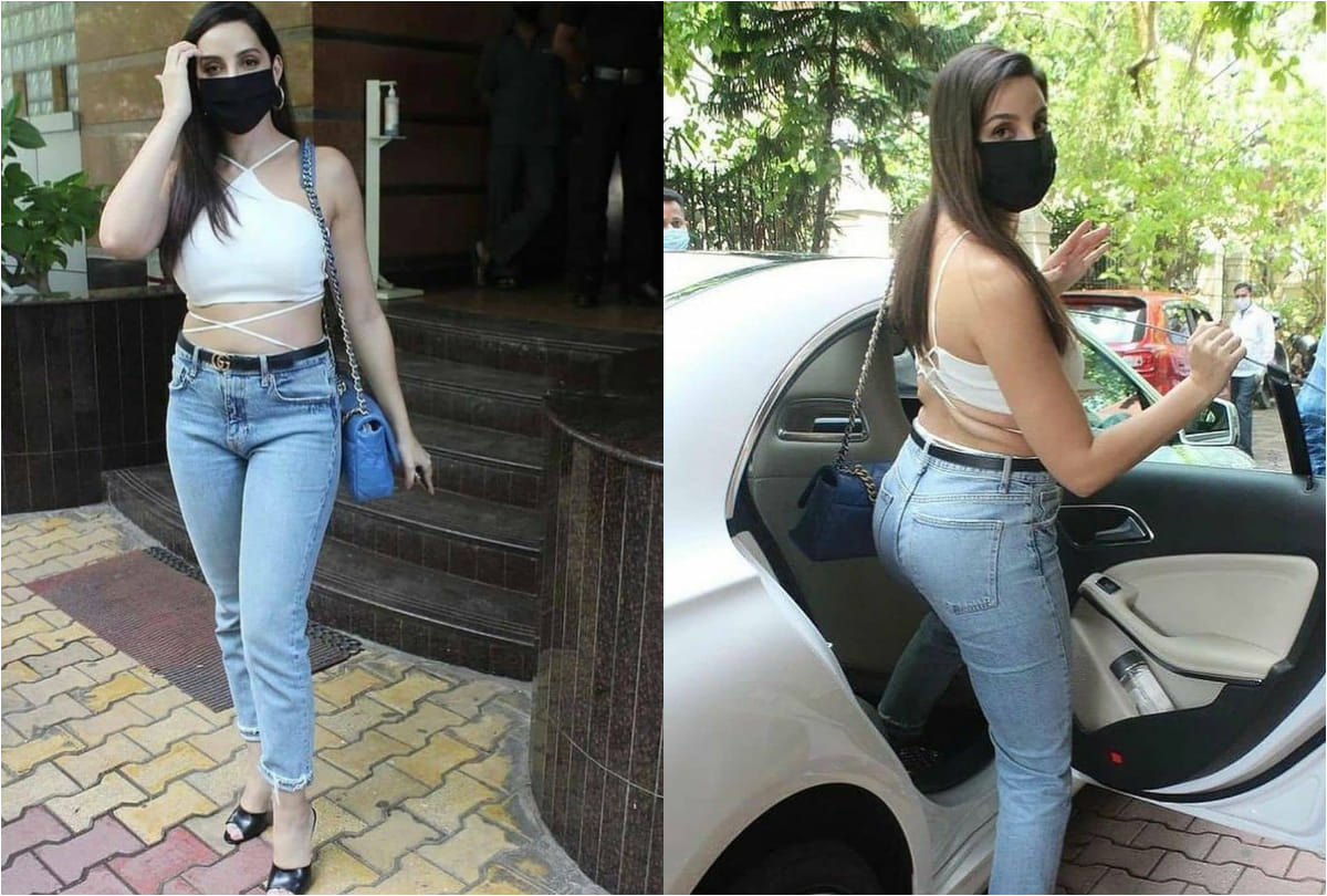 nora fatehi spotted in outside dubbing studio wearing white crop top show her curvy waist