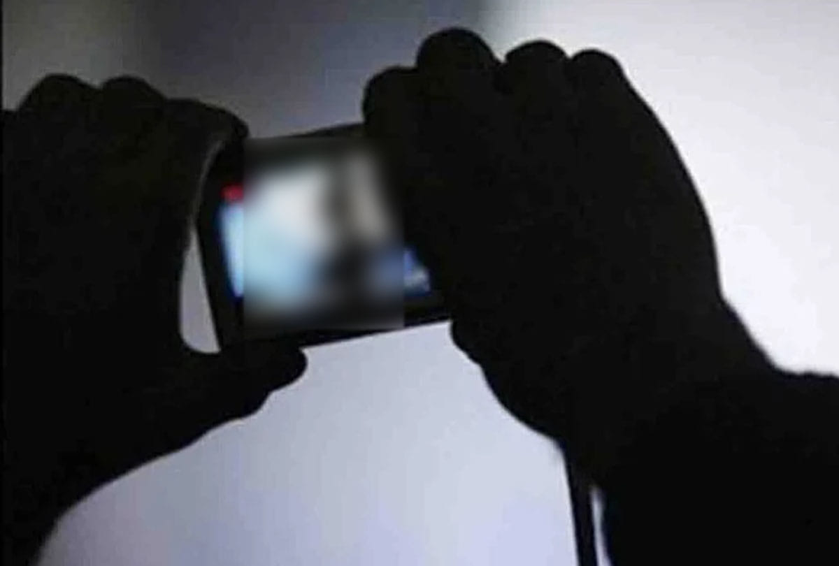 Blackmailed by showing obscene video of minor girl student