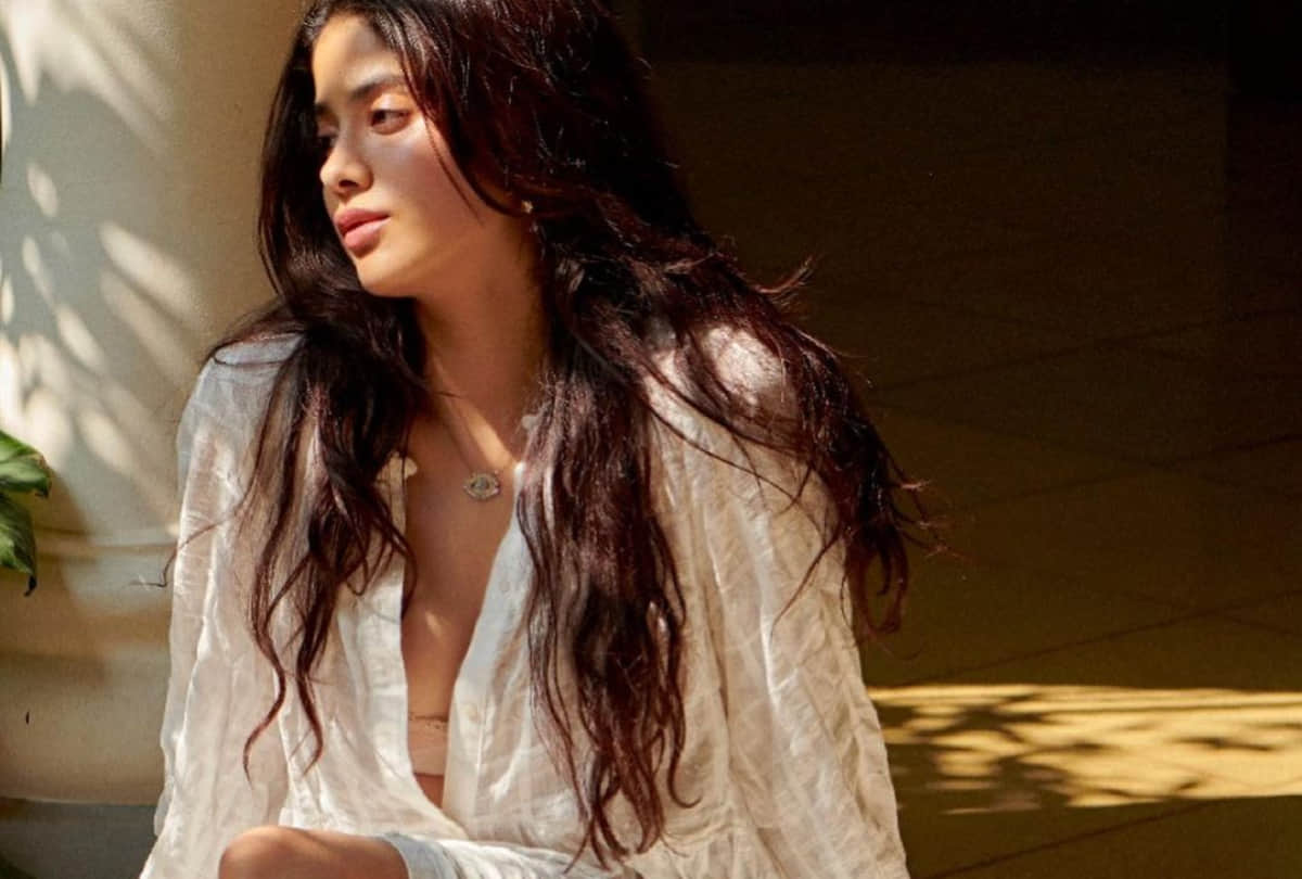 janhvi kapoor show her inner beauty in white thigh high slit front open button dress