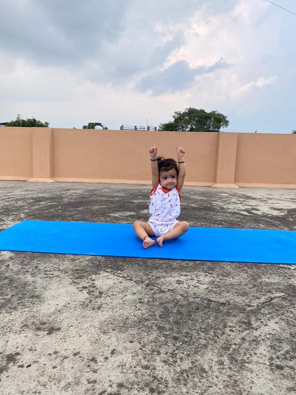 international yoga day 2021 : two and half year girl doing yoga