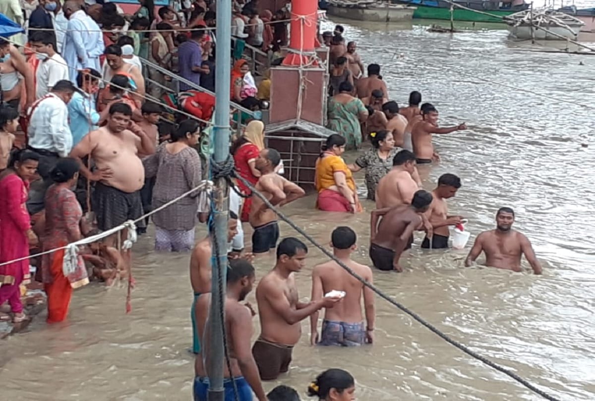 People take holy dip in Brajghat even during restrictions imposed