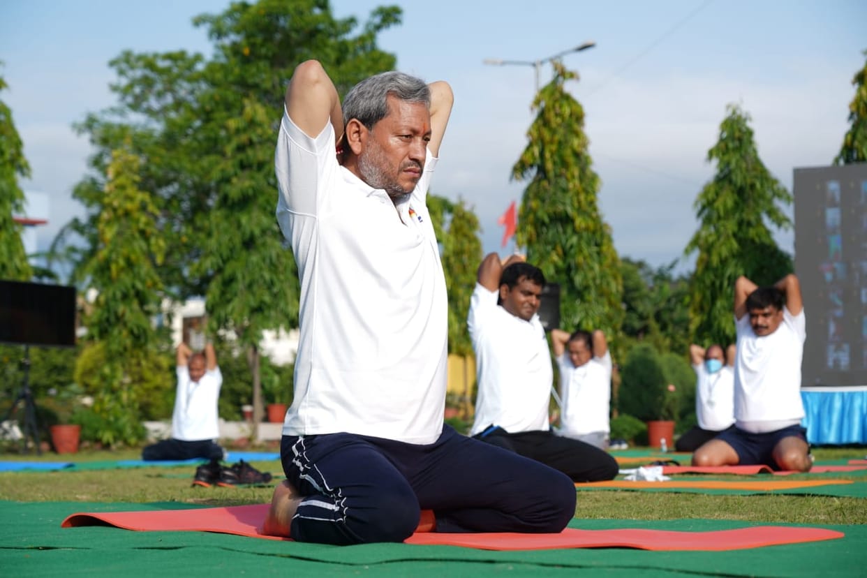 international yoga day 2021 : cm tirath singh rawat does yoga watch photos