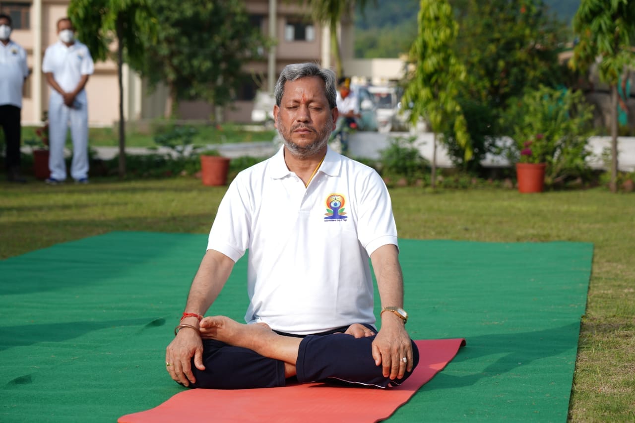 international yoga day 2021 : cm tirath singh rawat does yoga watch photos