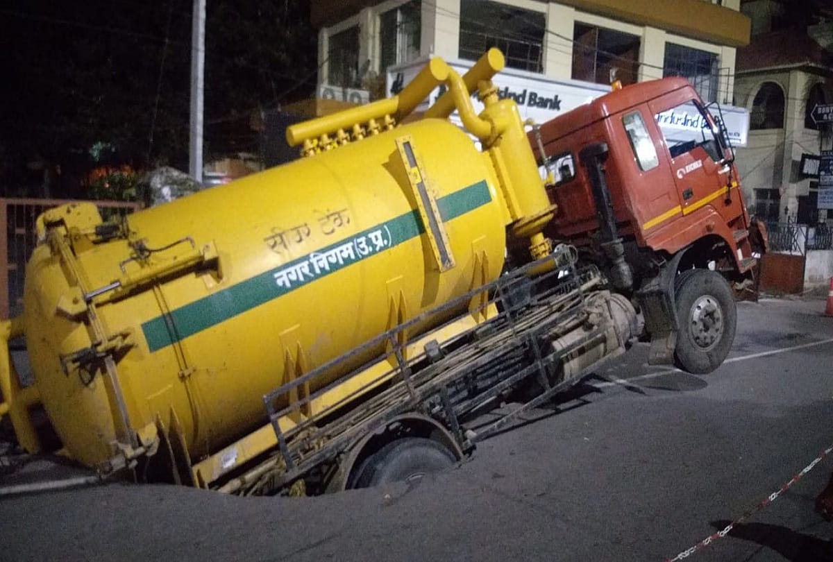 few steps away from cm yogi residence road sunken back part of sewage tank in the pit driver injured