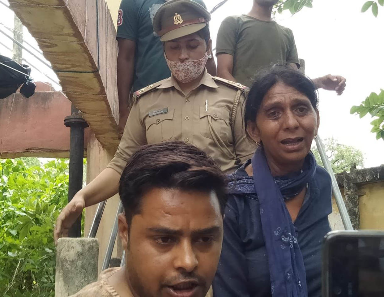 Woman climbed on tank to house, police brought down