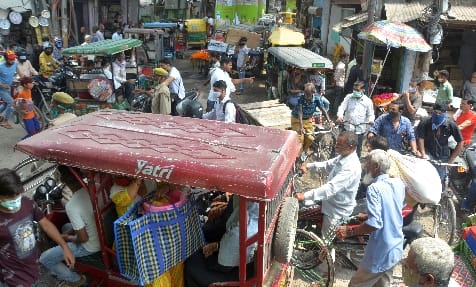 Traffic stuck in potholes at Shyamganj intersection