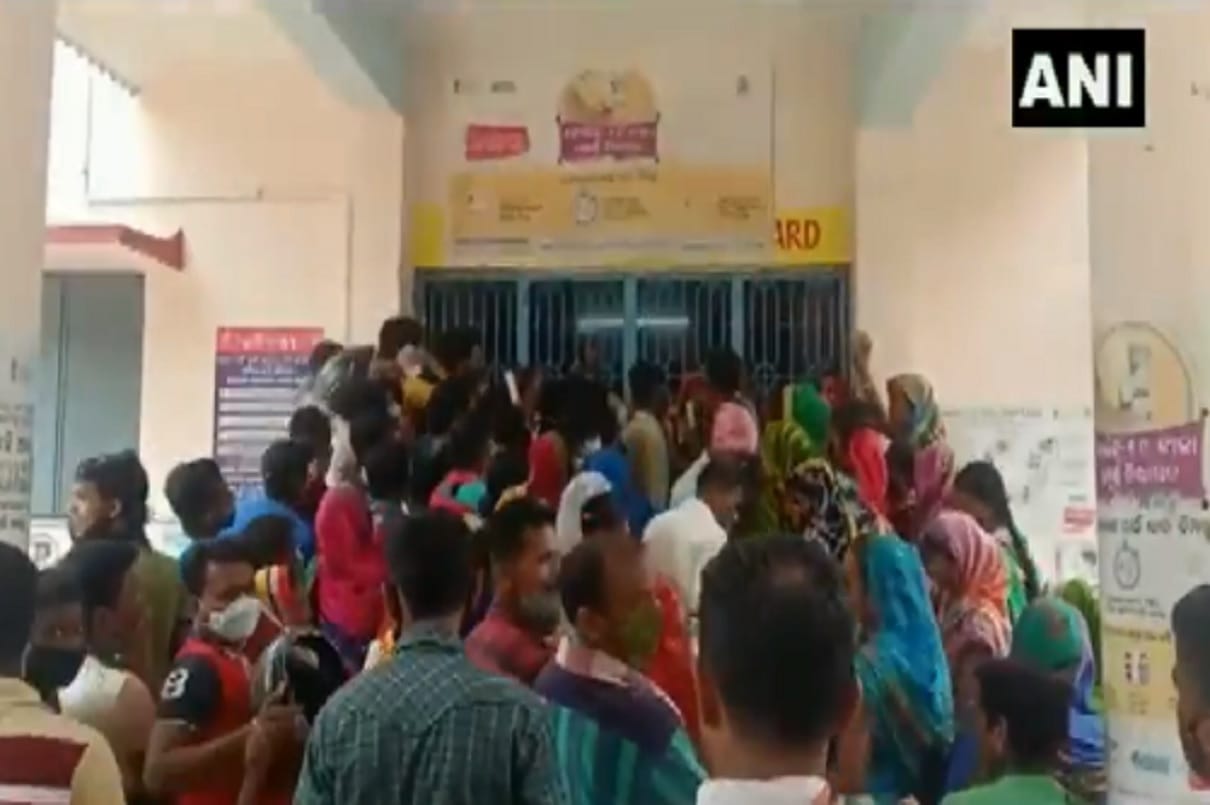 Peoplelose calm break barricades outside a vaccination center in Ganjam Odisha
