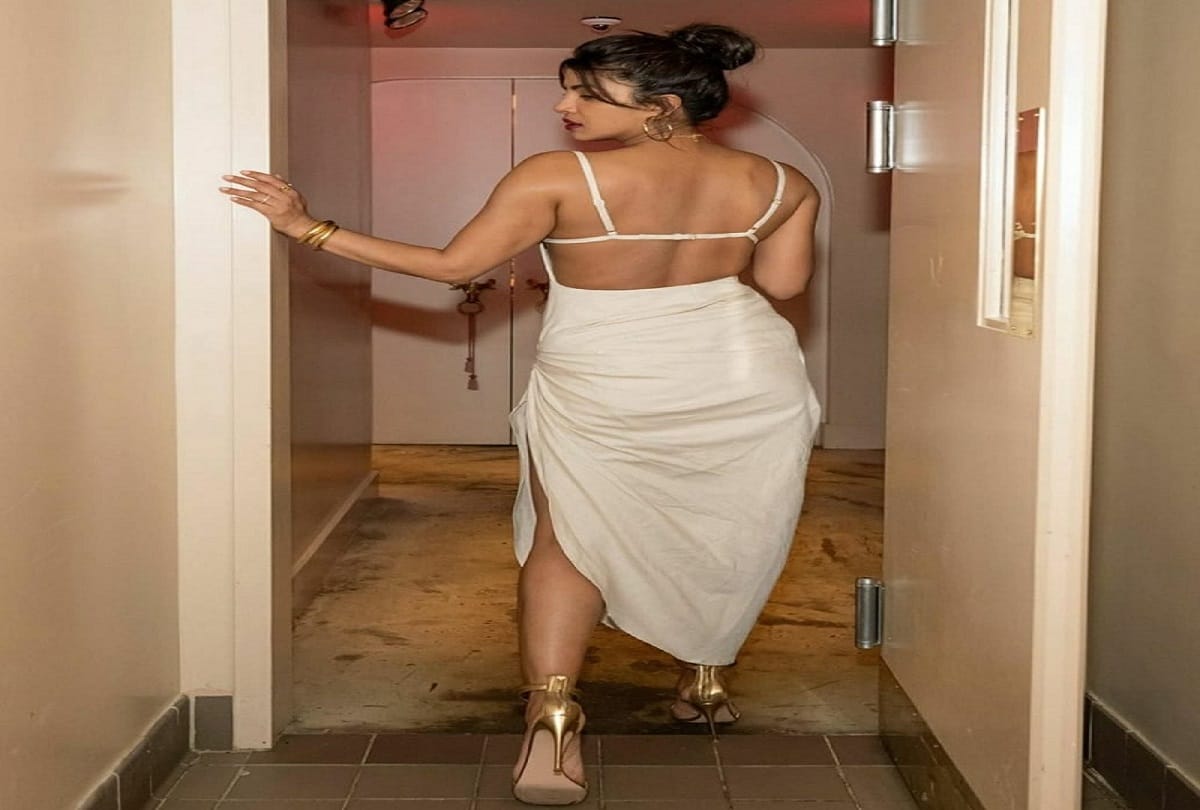 priyanka chopra white bold dress look in restaurant opening