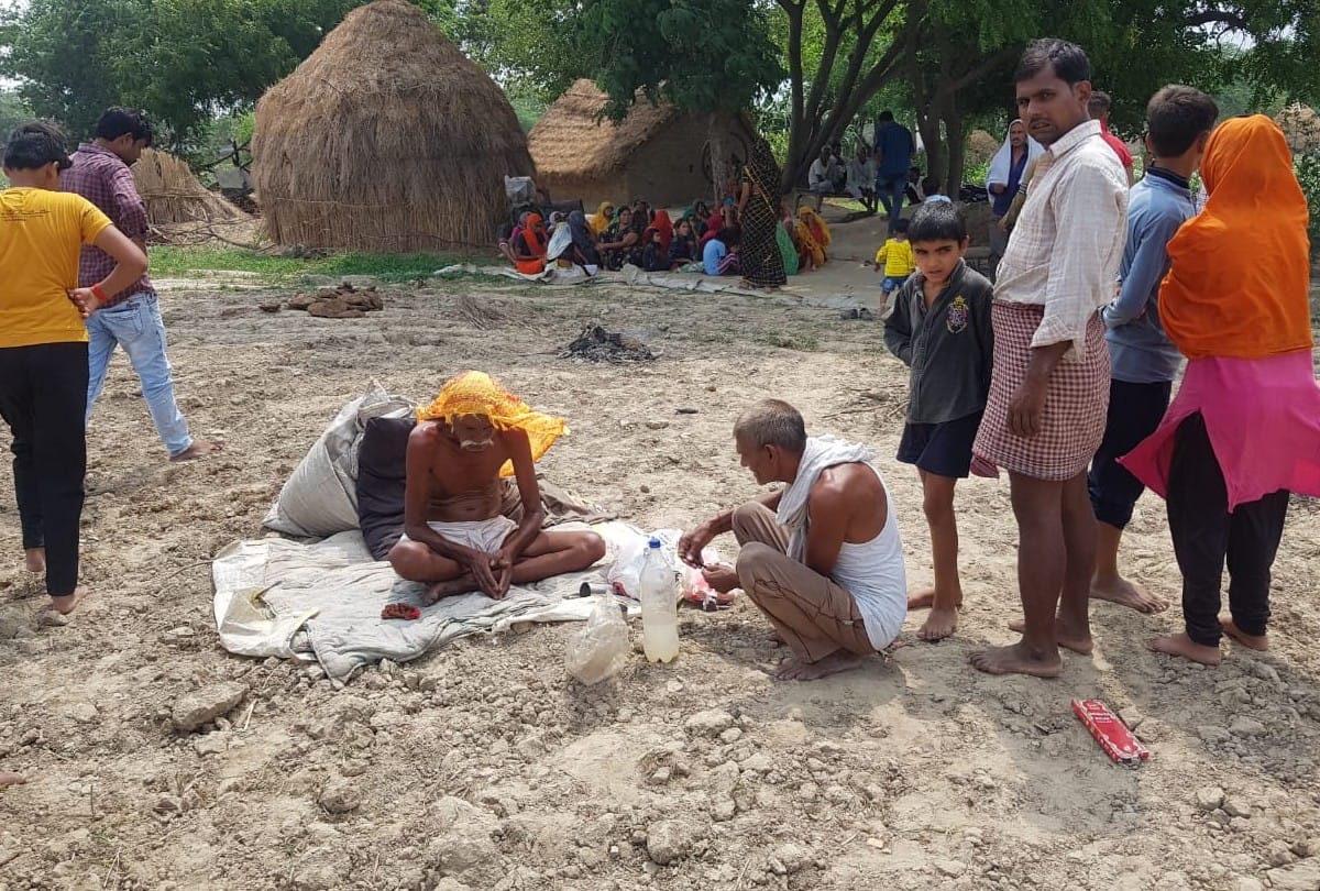 farmer sitting in worship of indra for rain in etah