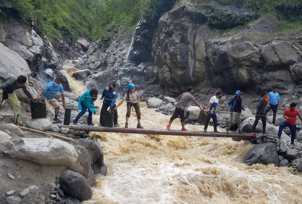 Uttarakhand Monsoon Rainfall News: People cross river in danger after Bridge Collapse in pithoragarh photos