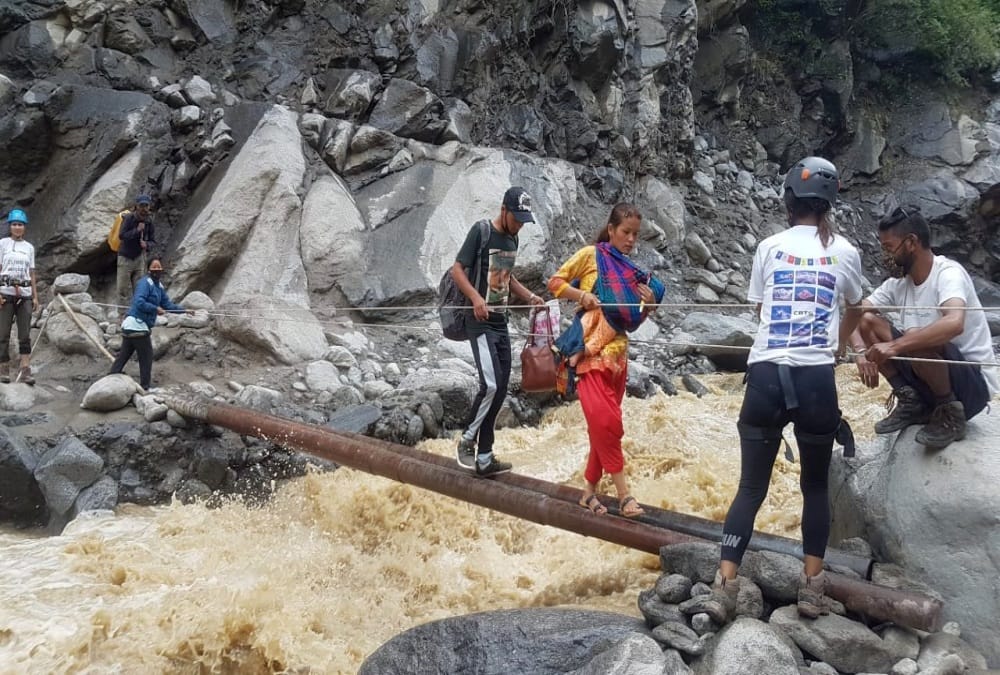 Uttarakhand Monsoon Rainfall News: People cross river in danger after Bridge Collapse in pithoragarh photos