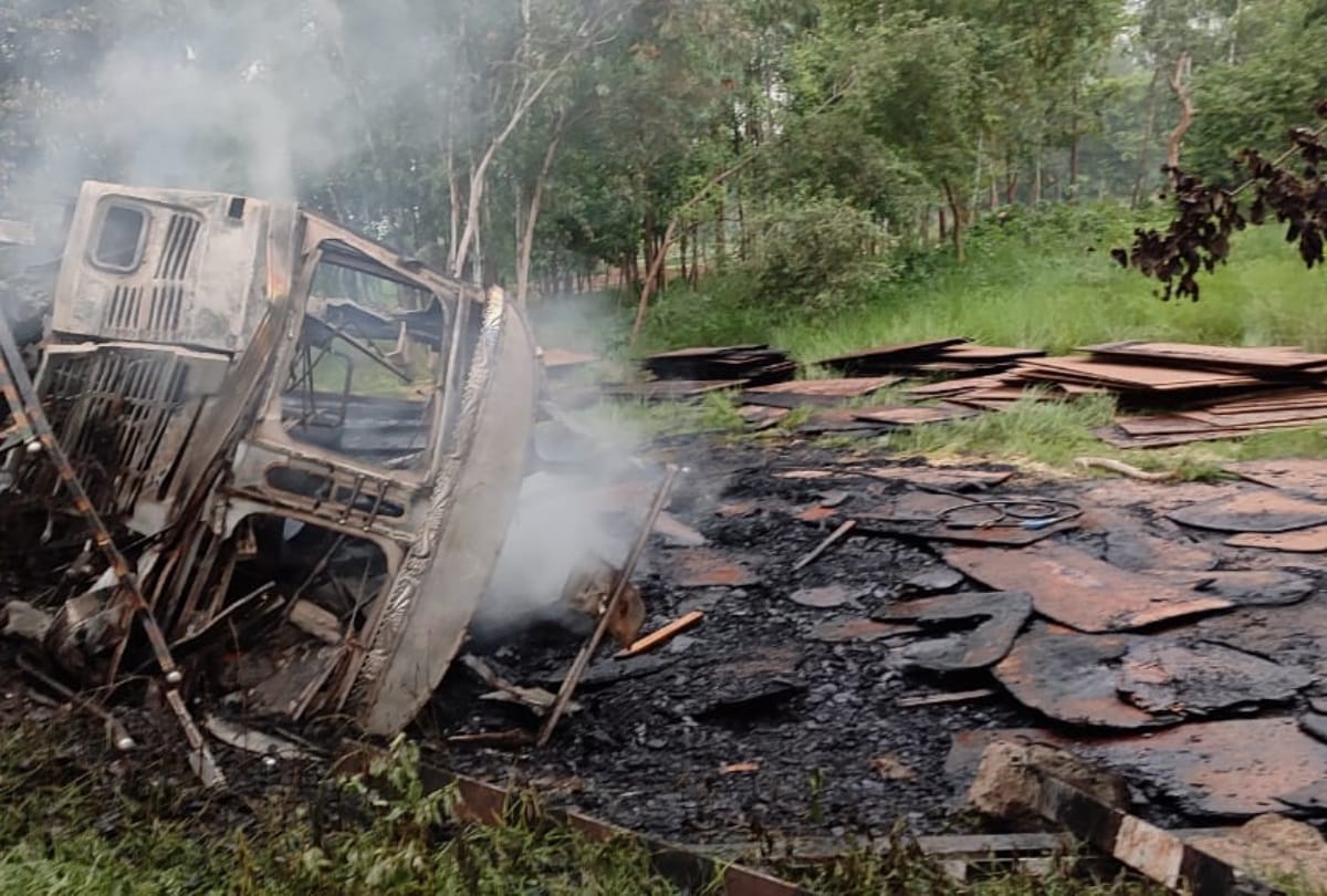 A truck falls down in a pathole and catches fire.