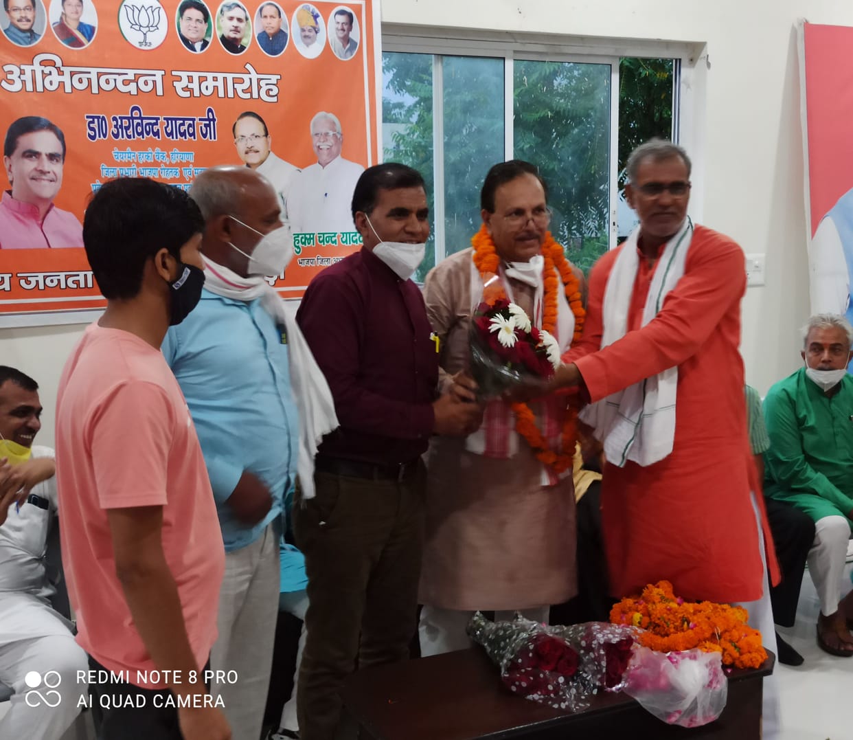 Faded congratulation ceremony, a group including the district president made a distance