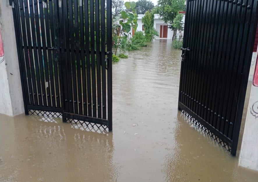 Water filled in school, teacher sitting in hotel