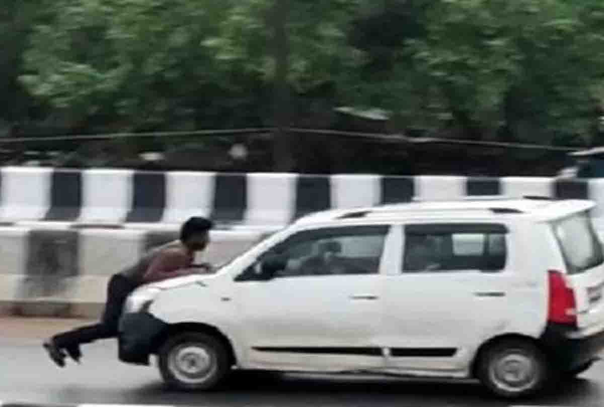 video viral of car running on jajmau flyover and man hanged on bonnet