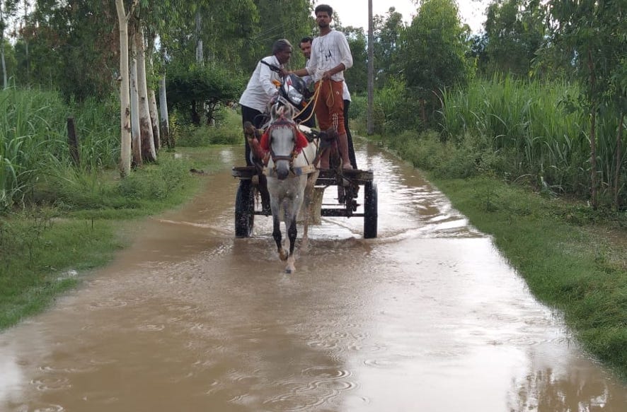 Loading a bike on a horse buggy is doing movement