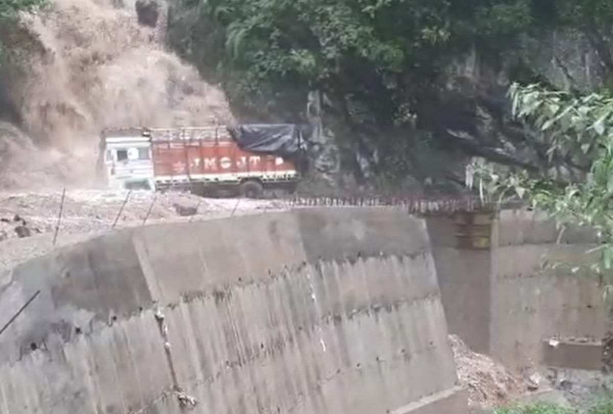 rivulet water flows over truck stranded on road in sirmour himachal pradesh