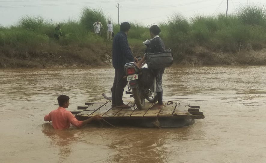 People crossing the river risking their lives