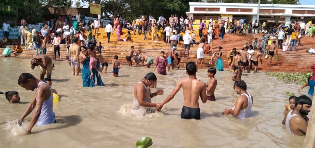 Taking a dip in the Ganges on Ashadhi Guru Purnima