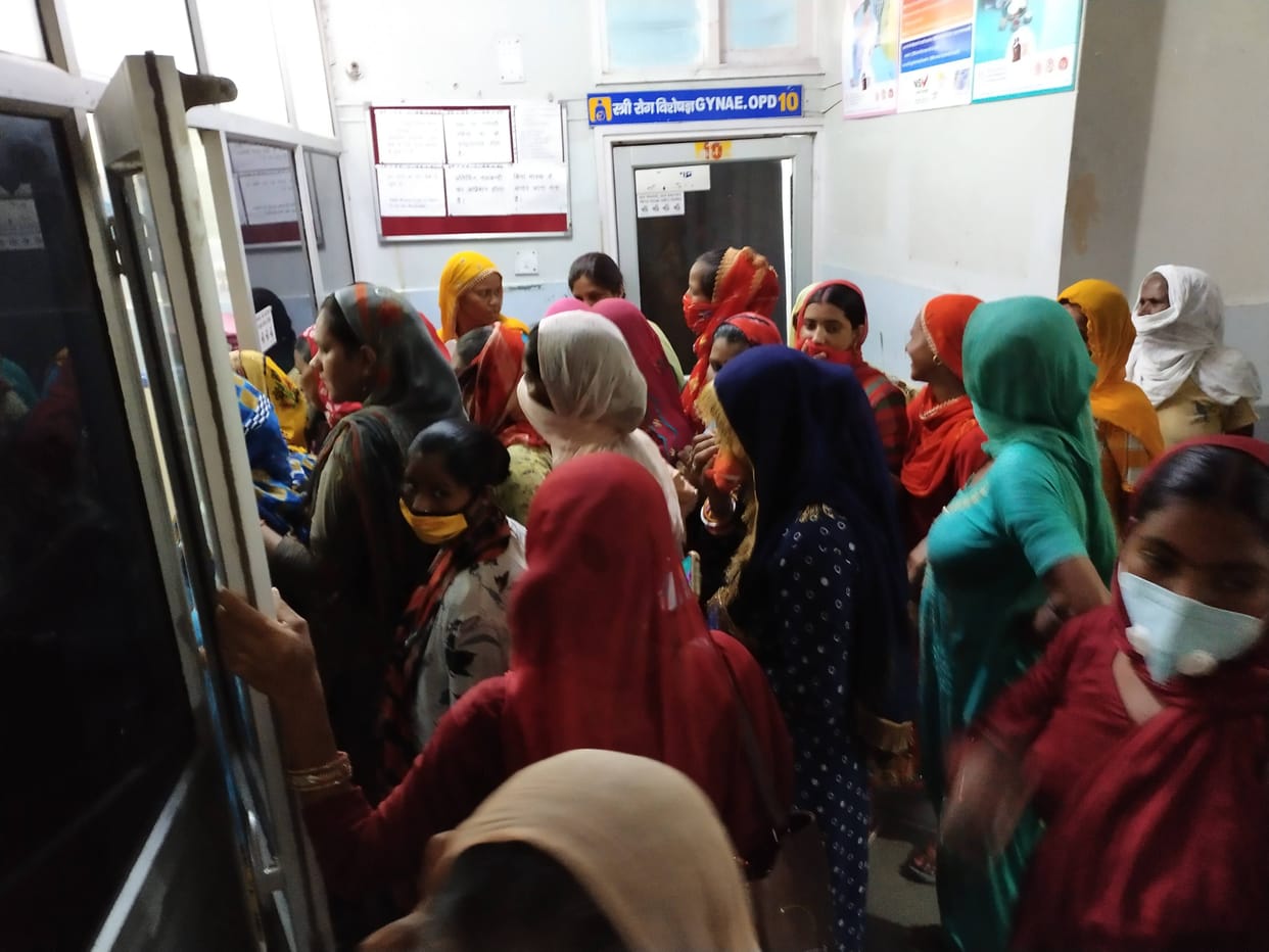Patients suffering from heat, no fan in waiting hall, chaos outside OPD