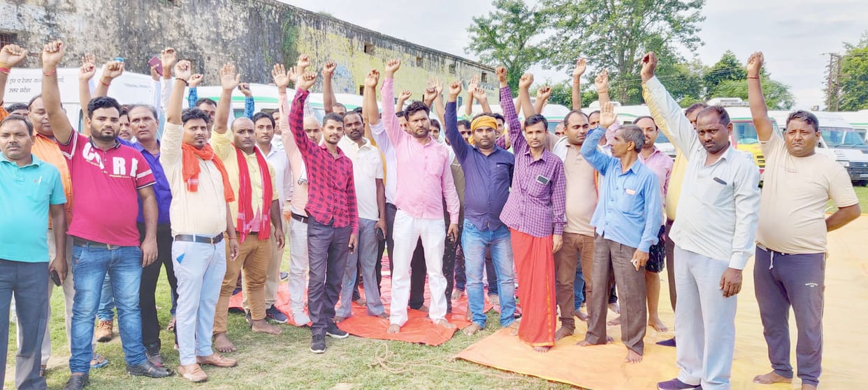 Employees demonstrated by standing an ambulance