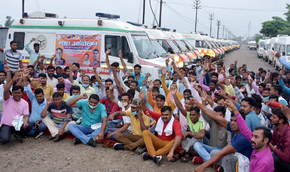 Employees on dharna by jamming the wheel of an ambulance