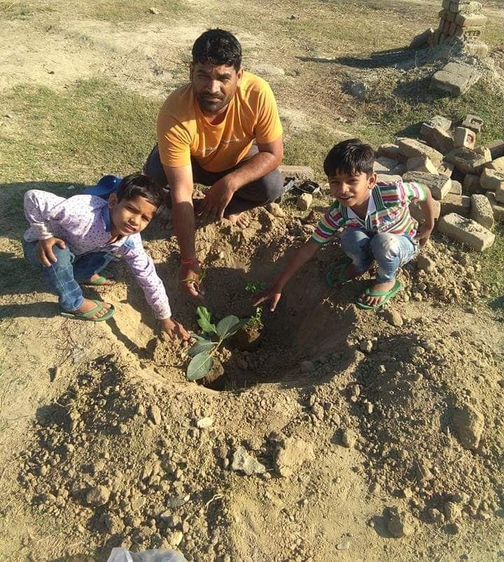Environment lovers engaged in saving nature by planting trees