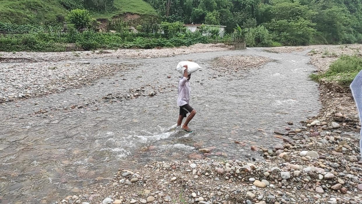 three men stuck in flood
