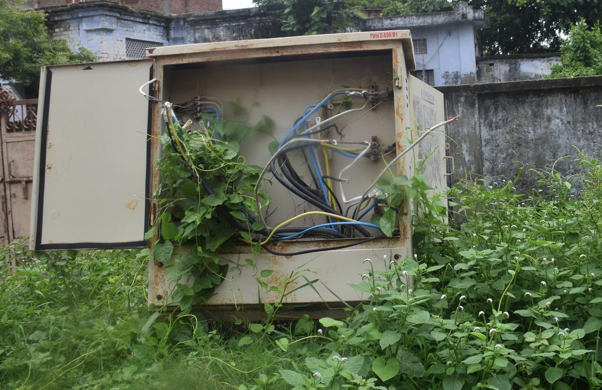 Broken junction box, cables scattered on the road are telling stories