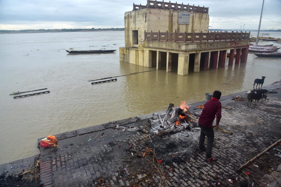 ganga water level increasing in varanasi about to touch danger mark ghat lost contact and also changed cremation site see photos