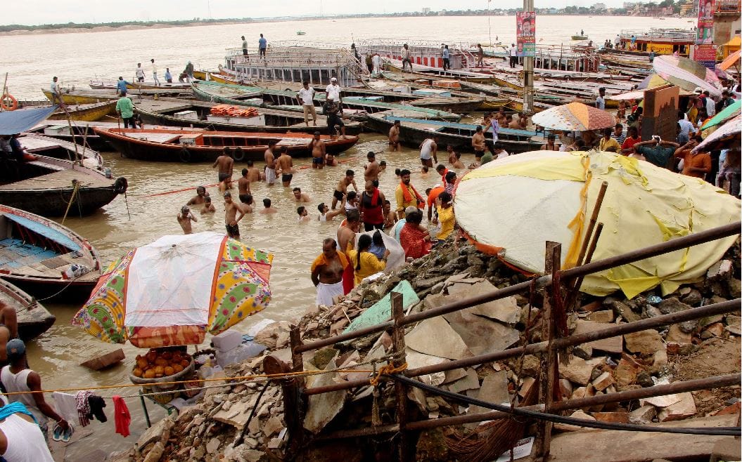 ganga water level increasing in varanasi about to touch danger mark ghat lost contact and also changed cremation site see photos