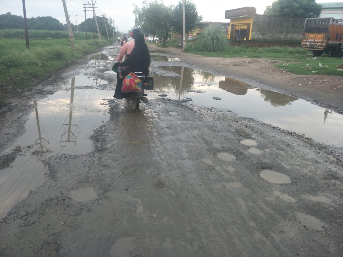 State highway turned into potholes, difficult to walk