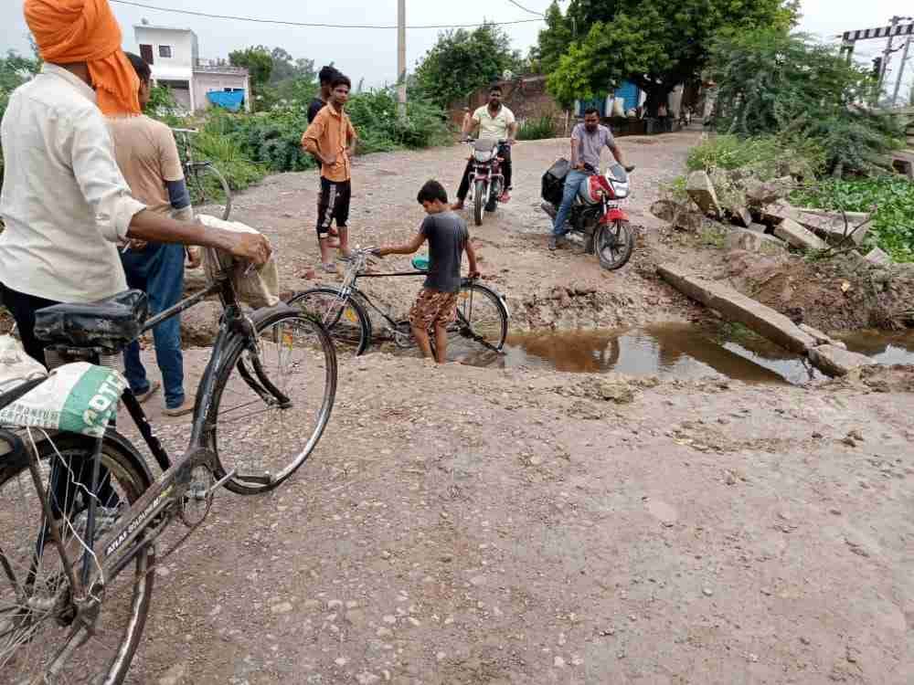 people annoyed due to water logging, damage the road