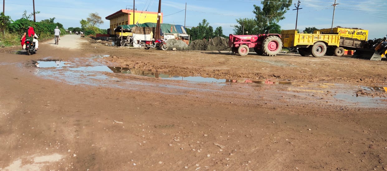 Potholes made in the road due to rain, passersby upset