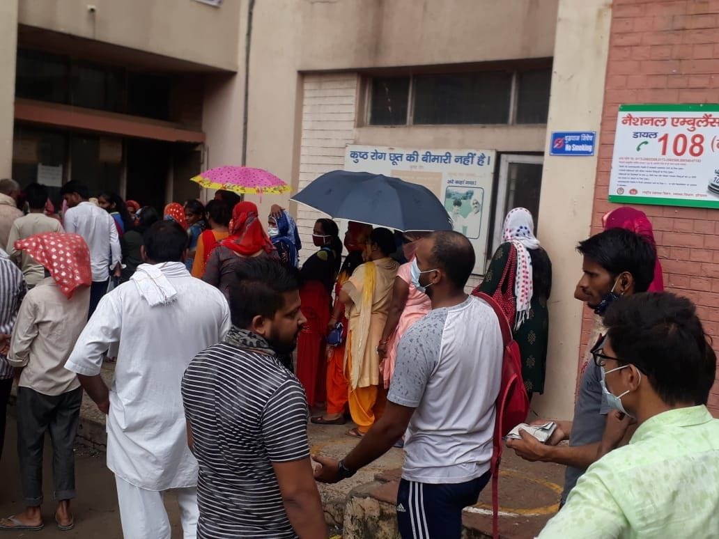 patients get opd cards made by standing in the rain