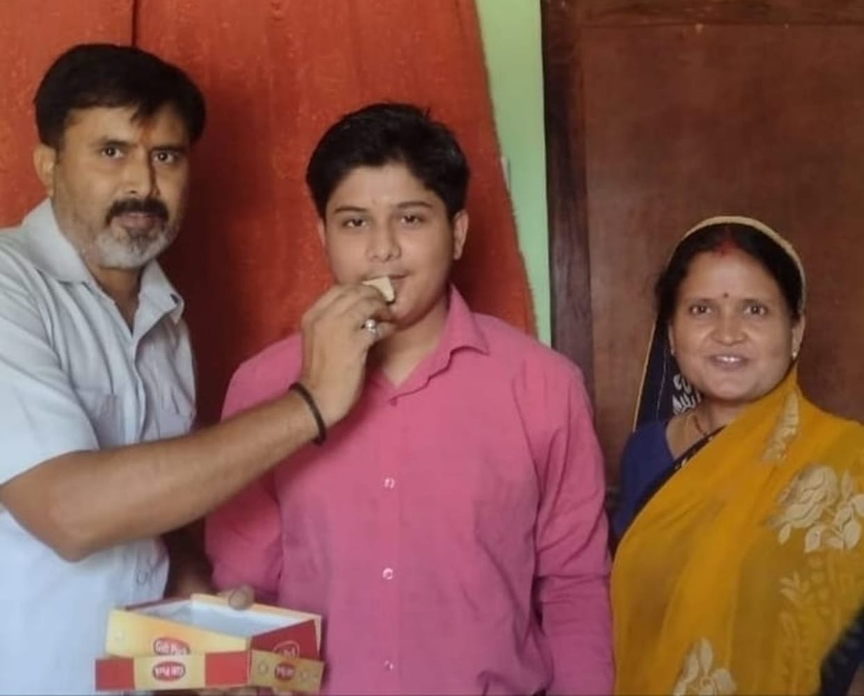 Jai Karthik topped the district with 98.8% marks
