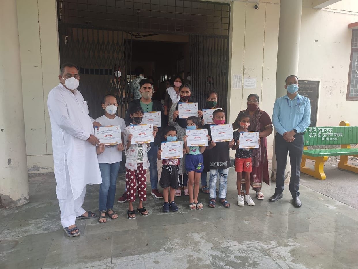 Certificates of Vatsalya Yojana distributed to children