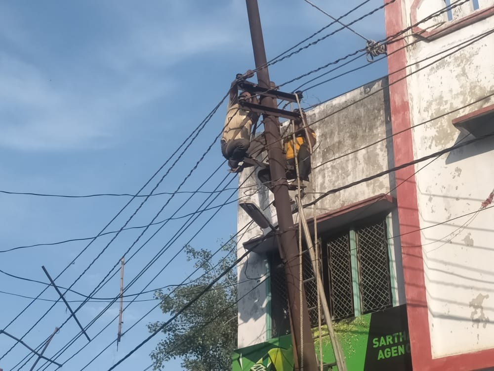 Shattered pole removed, power line connected to new