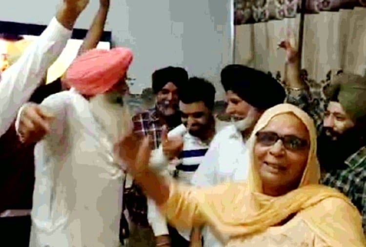 People celebrate victory at the village of hockey players Harmanpreet and Gurjant Singh In Amritsar