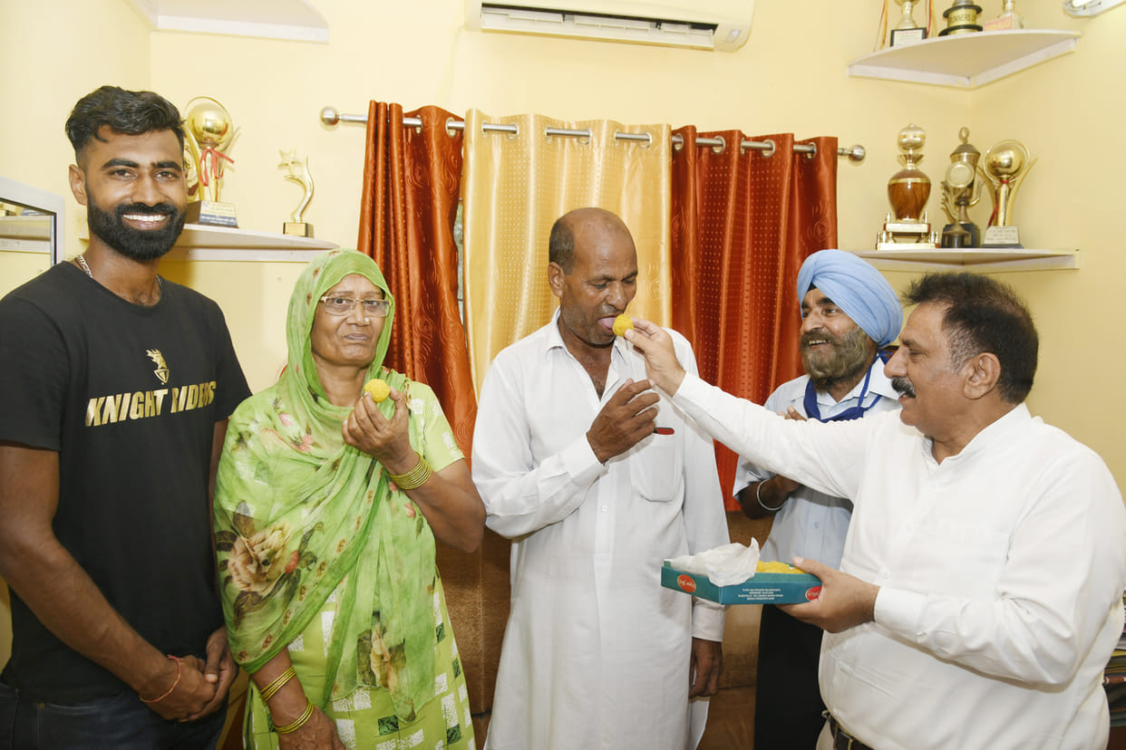 Companion players reached Olympian Surendra's house dancing to the beat of dhol