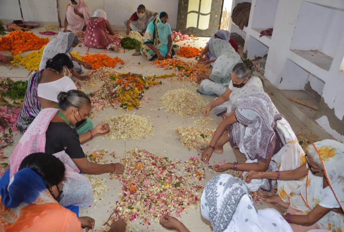 Widow women making incense sticks with flowers offered in Banke Bihari temple in Vrindavan