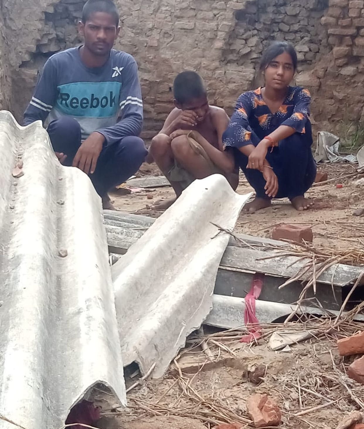 Brothers and sisters forced to live under the open sky in the rain