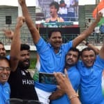पंचकूला में नीरज की जीत का जश्न मनाते कोच नसीम अहमद।