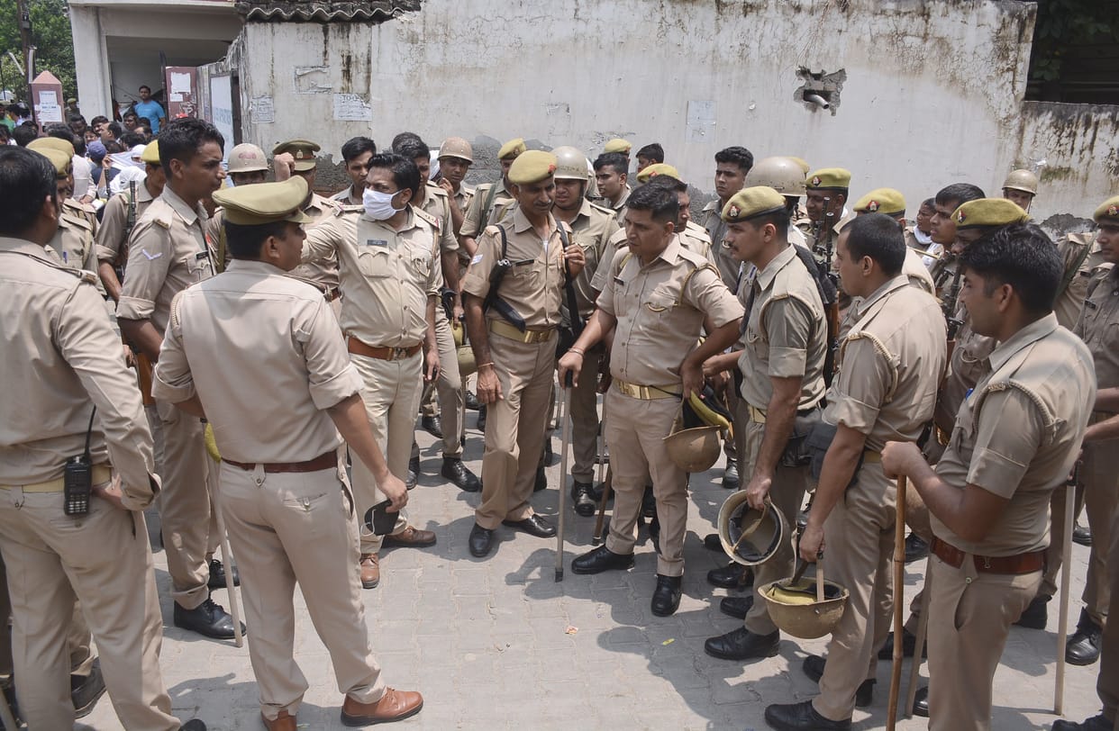 SP BJP face to face in graveyard dispute, uproar, camped at police station for hours